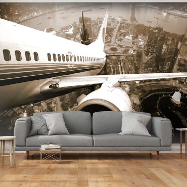 Wallpaper - Airplane taking off from the city